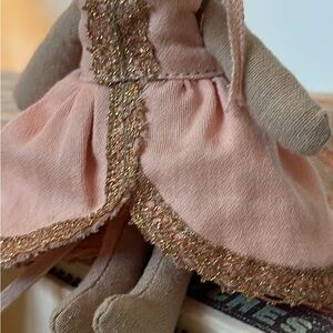 Adorable Pink Plush Doll with Gold Accents